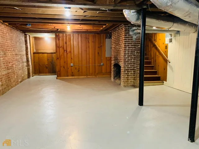 a view of a garage with stairs