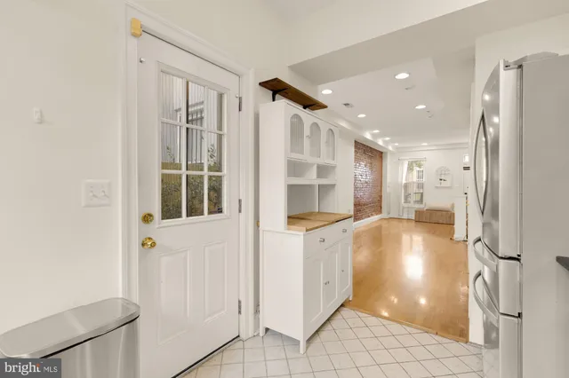 a bedroom with a bed and a dresser in it