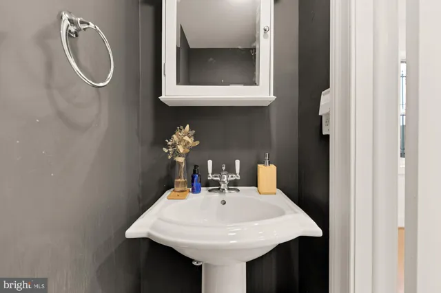 a bedroom with a bed and a lamp