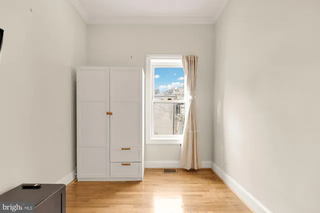 a view of a hallway with washer and dryer