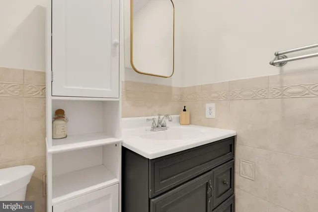 a view of a chair and tables in the patio