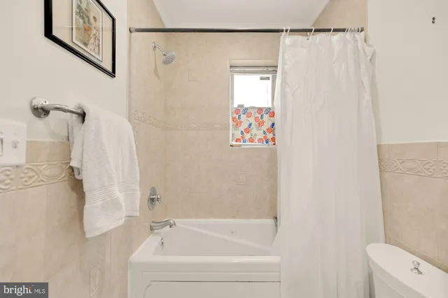 a view of a patio with table and chairs and potted plants