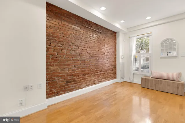 a view of an empty room with glass door