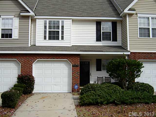 a front view of a house with a garage
