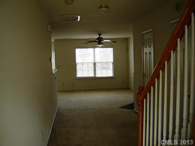 11638 Rabbit Ridge Road, Unit 11638 Charlotte, NC 28270 - Photo 2 of 15 wooden floor in an empty room with a window