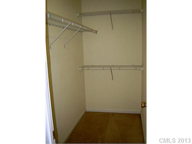 11638 Rabbit Ridge Road, Unit 11638 Charlotte, NC 28270 - Photo 11 of 15 a view of walk in closet with rug