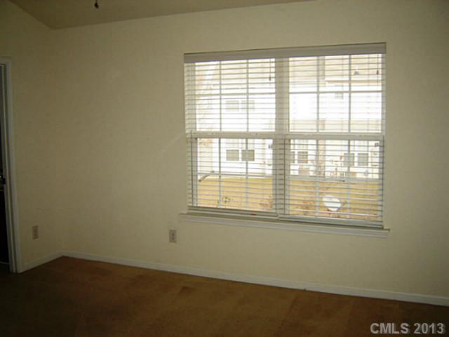 11638 Rabbit Ridge Road, Unit 11638 Charlotte, NC 28270 - Photo 13 of 15 a view of an empty room with a window