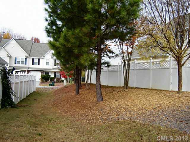 11638 Rabbit Ridge Road, Unit 11638 Charlotte, NC 28270 - Photo 14 of 15 a view of a house with a tree in front of it