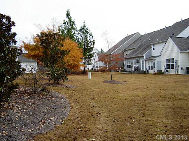 11638 Rabbit Ridge Road, Unit 11638 Charlotte, NC 28270 - Photo 15 of 15 a view of a house with a yard