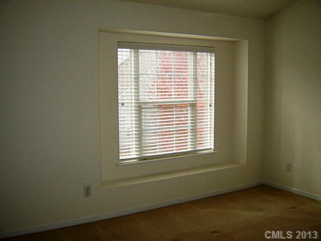 11638 Rabbit Ridge Road, Unit 11638 Charlotte, NC 28270 - Photo 10 of 15 a view of an empty room with a window