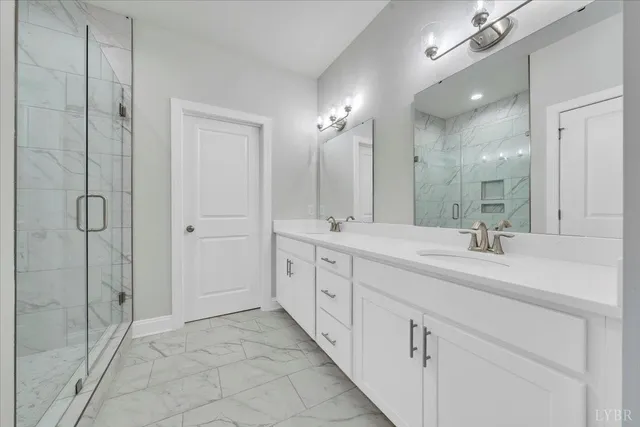 a spacious bathroom with double sink and a mirror