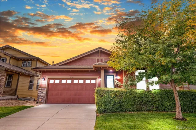 a view of a house with a small yard