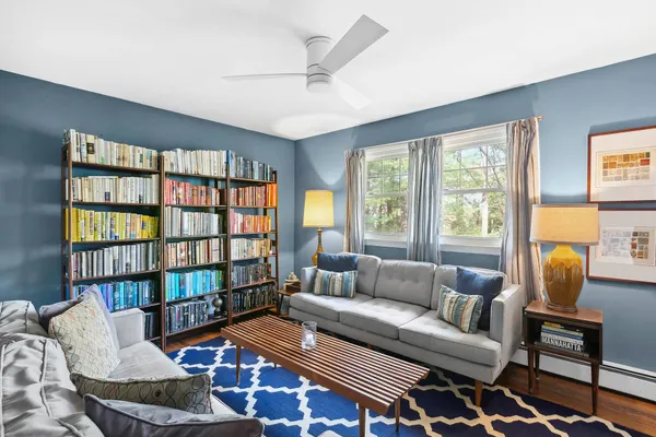 a living room with furniture and a window