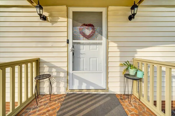 a view of entryway with wooden floor and stairs