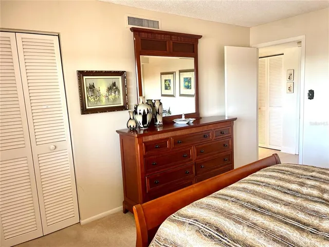 a spacious bathroom with a sink and a large mirror