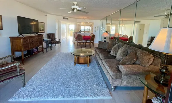 a bathroom with a granite countertop sink mirror vanity and toilet