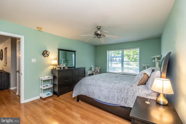 a bed room with a bed and a window