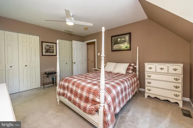 a bedroom with a bed and a cabinets