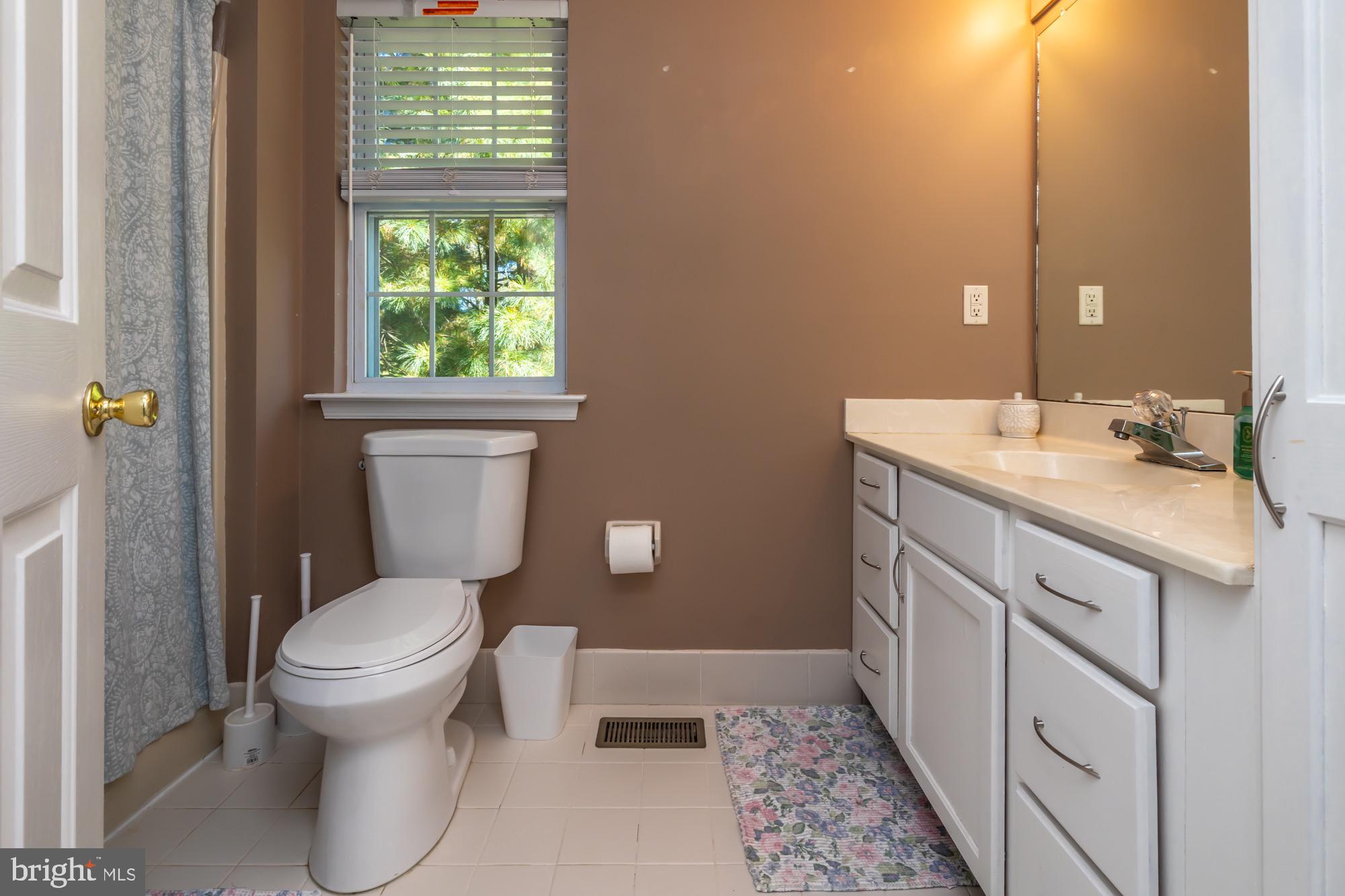 31 North Hawthorne Road Coatesville, PA 19320 - Photo 28 of 41 a bathroom with a sink toilet and window