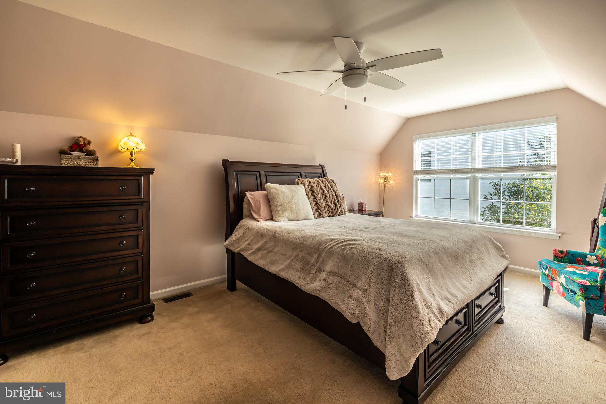 31 North Hawthorne Road Coatesville, PA 19320 - Photo 31 of 41 a bed sitting in a bedroom next to a window and a chandelier