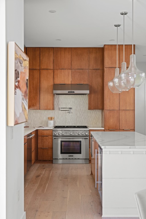 2105 Enfield Road, Unit A Austin, TX 78703 - Photo 16 of 38 a kitchen with stainless steel appliances granite countertop a sink and a stove