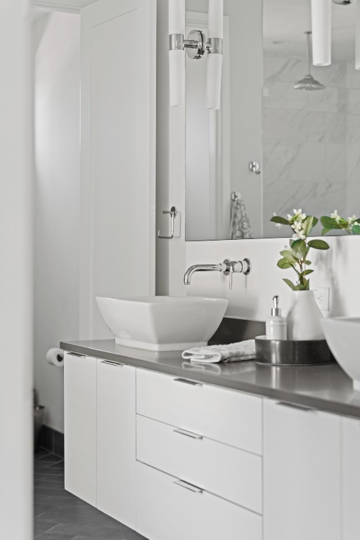 2105 Enfield Road, Unit A Austin, TX 78703 - Photo 21 of 38 a bathroom with a sink and a white cabinet