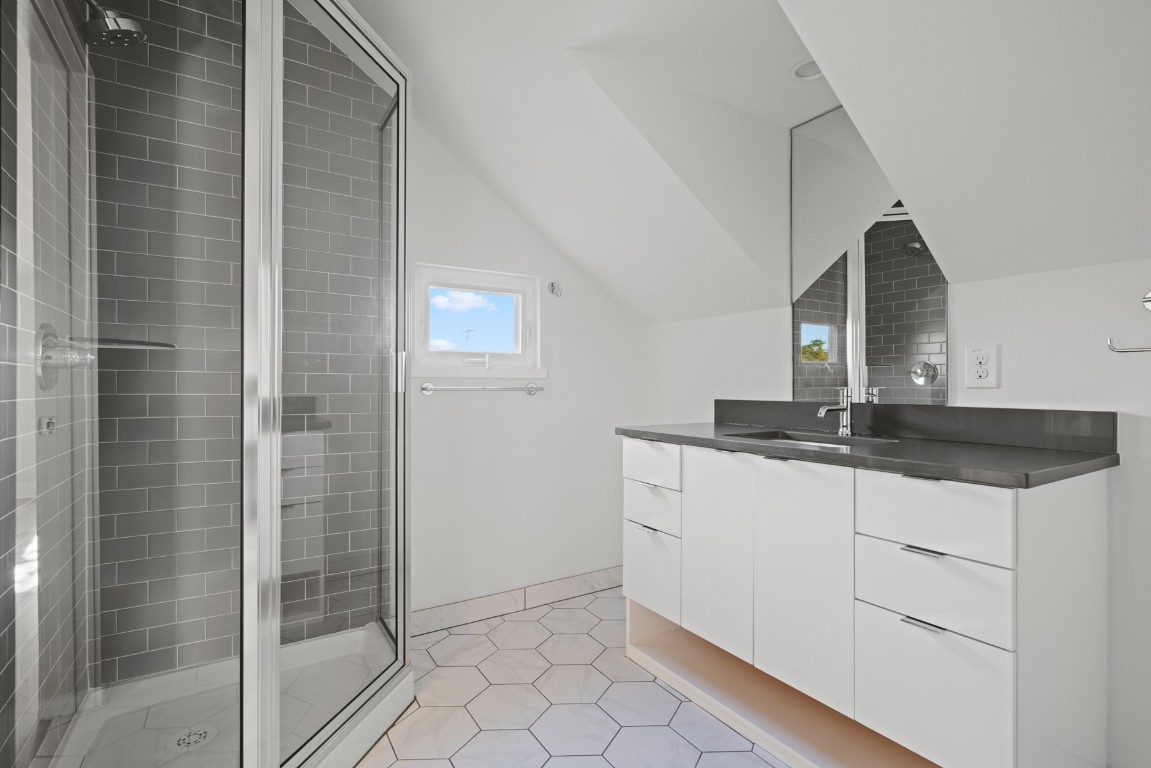 2105 Enfield Road, Unit A Austin, TX 78703 - Photo 30 of 38 a kitchen with a sink and cabinets