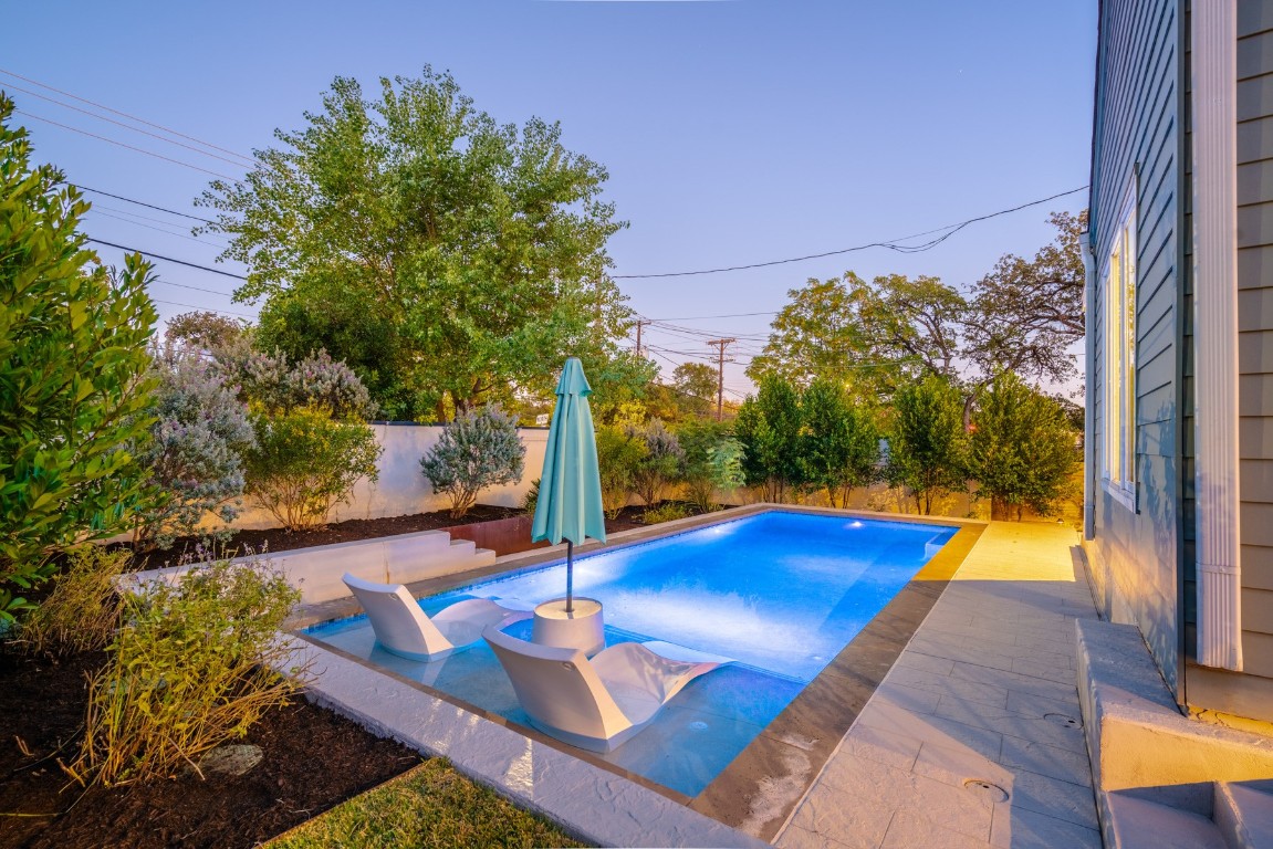 2105 Enfield Road, Unit A Austin, TX 78703 - Photo 36 of 38 a view of a backyard with swimming pool