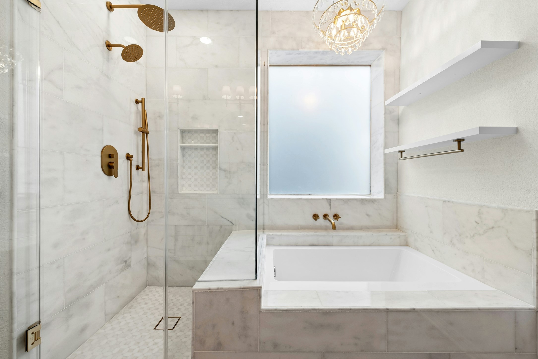 813 Caribou Ridge Trail Pflugerville, TX 78660 - Photo 23 of 39 Elegant spa retreat with soaking tub, dual rain showers, marble tile, and designer chandelier lighting.