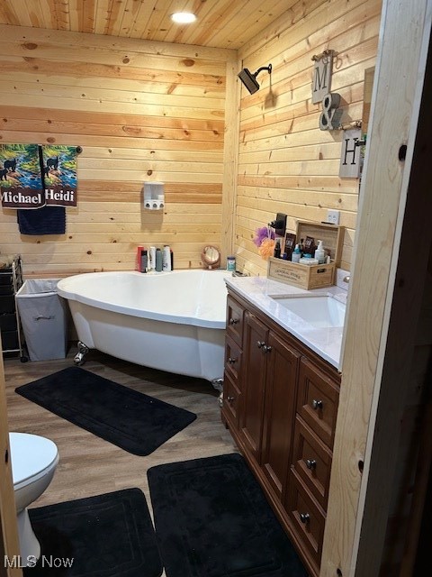 2445 McCord Hill Road Wellsburg, WV 26070 - Photo 6 of 37 Bathroom with wooden ceiling, a soaking tub, vanity, wood walls, and light wood finished floors