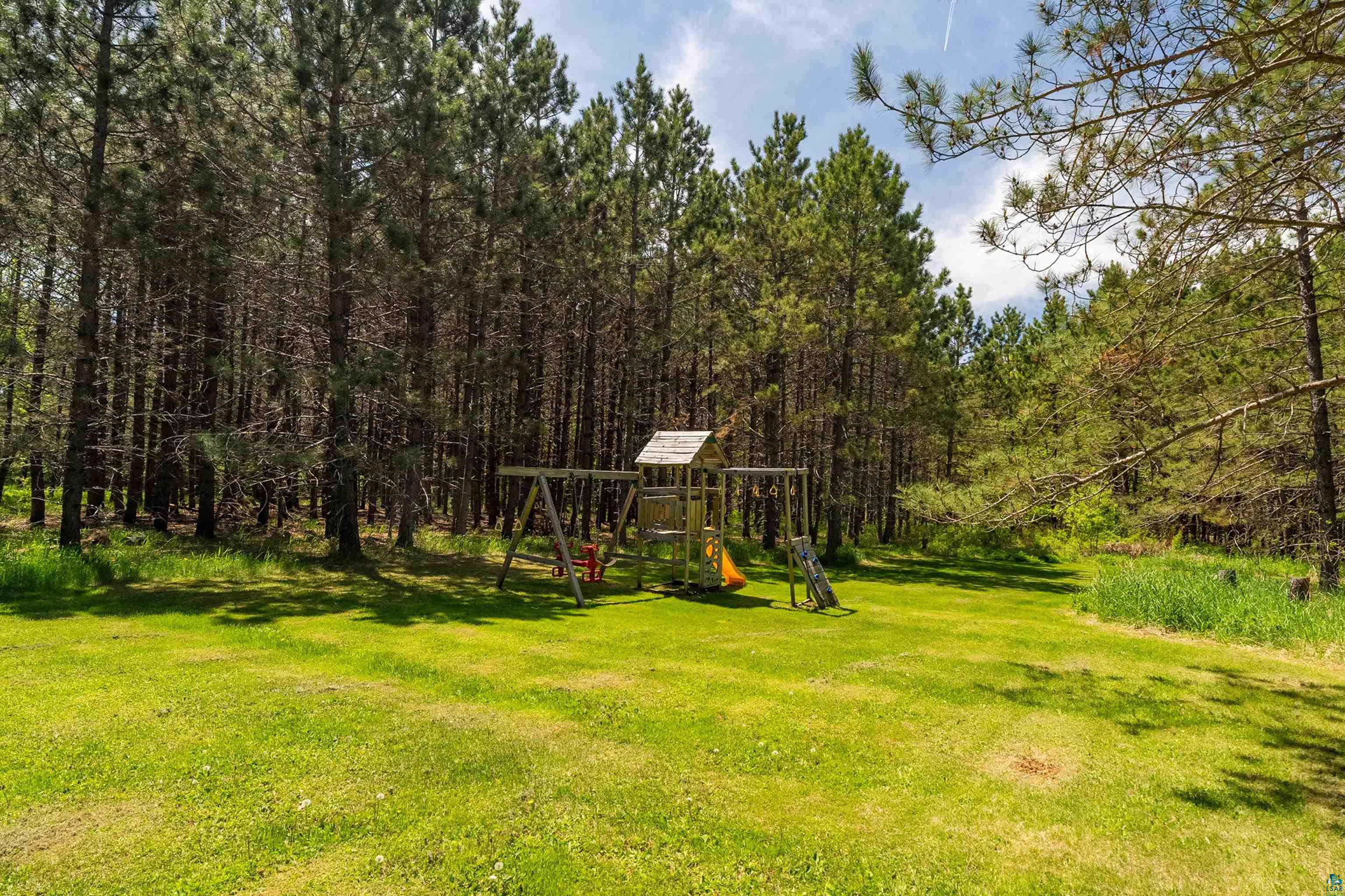 75 East Stark Road Esko, MN 55733 - Photo 75 of 87 Expansive green lawn surrounded by mature pine trees