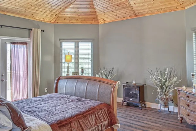 a bedroom with bed and a window