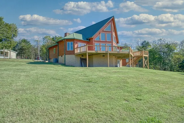 a view of an empty room with a bathroom and a mirror