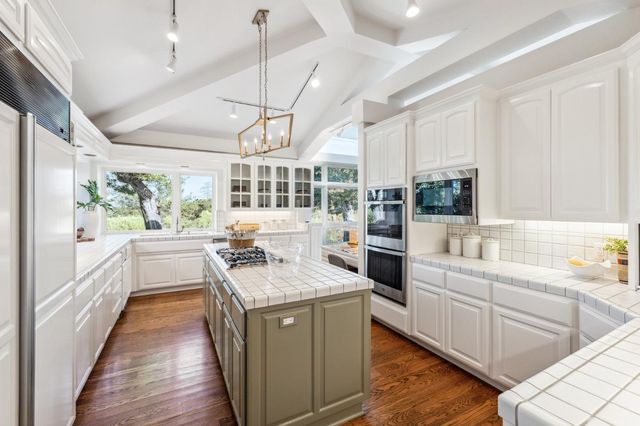 a view of a patio with a table chairs and backyard