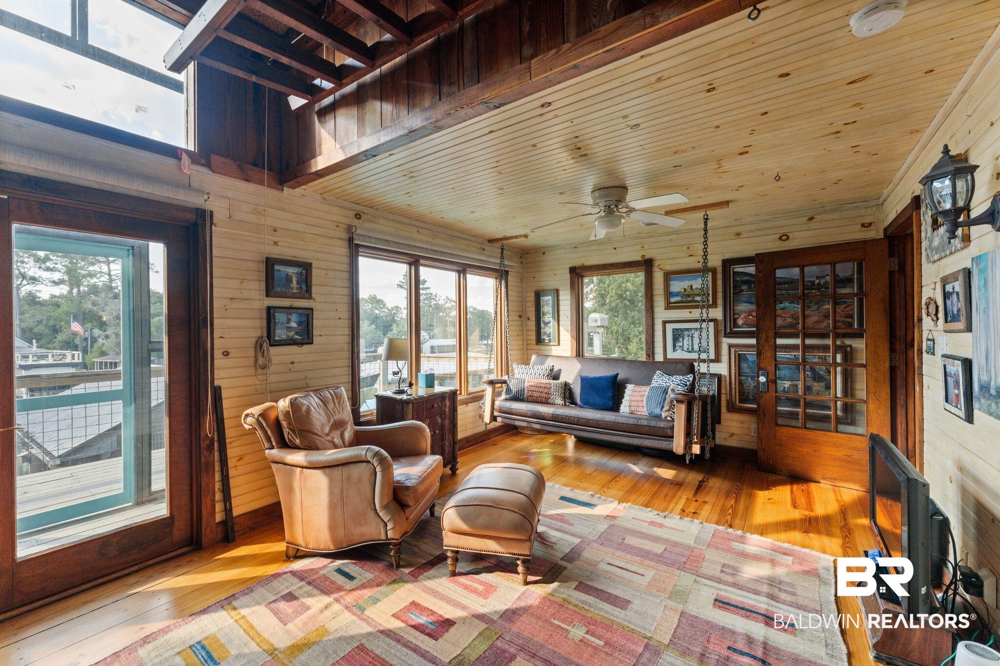 16451 Honey Road Summerdale, AL 36580 - Photo 32 of 55 Sitting room with hardwood / wood-style floors, wood walls, wood ceiling, and a ceiling fan