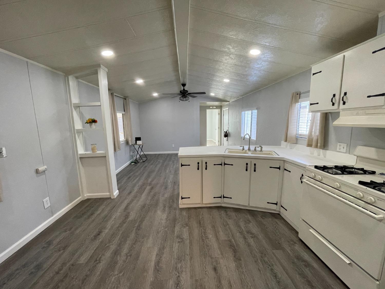 2110 Helm Avenue, Unit 16 Clovis, CA 93612 - Photo 17 of 31 a kitchen with a sink stainless steel appliances and cabinets