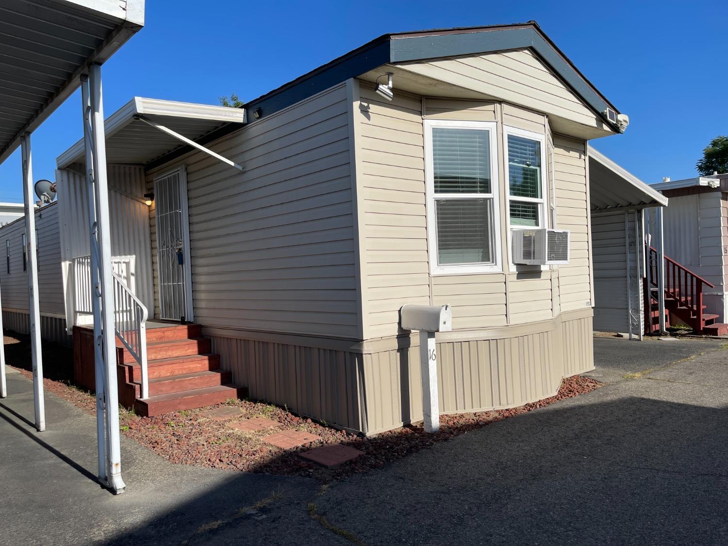 2110 Helm Avenue, Unit 16 Clovis, CA 93612 - Photo 4 of 31 a front view of a house with a yard