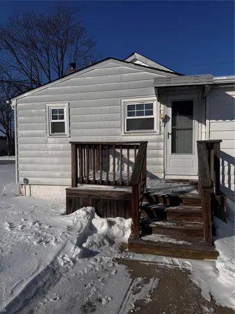 a front view of a house with stairs