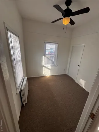a view of empty room with windows