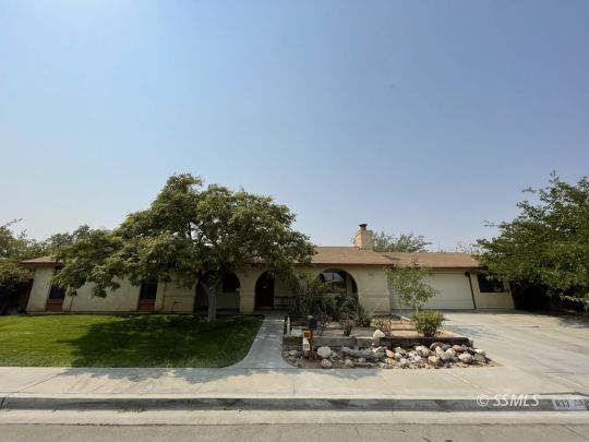 833 West Perdew Avenue Ridgecrest, CA 93555 - Photo 1 of 8 a view of a house with a yard and sitting area