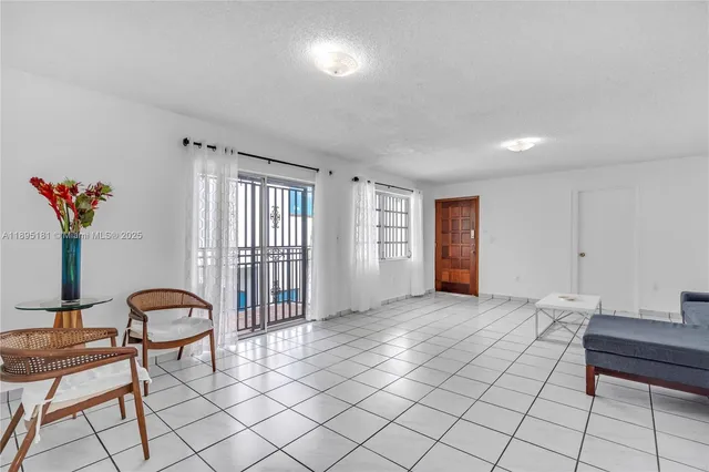 a view of a livingroom with furniture and window