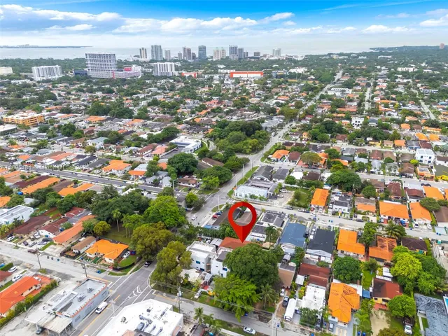 an aerial view of residential houses with outdoor space