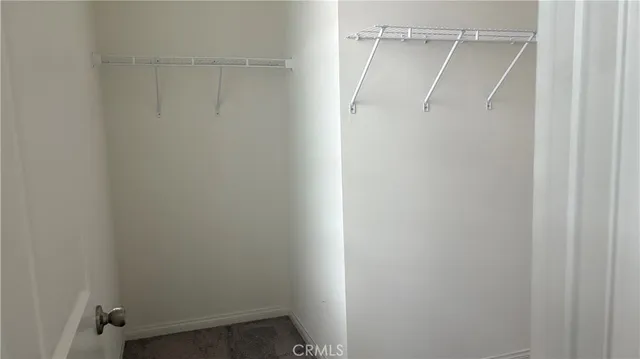 a view of an empty walk in closet