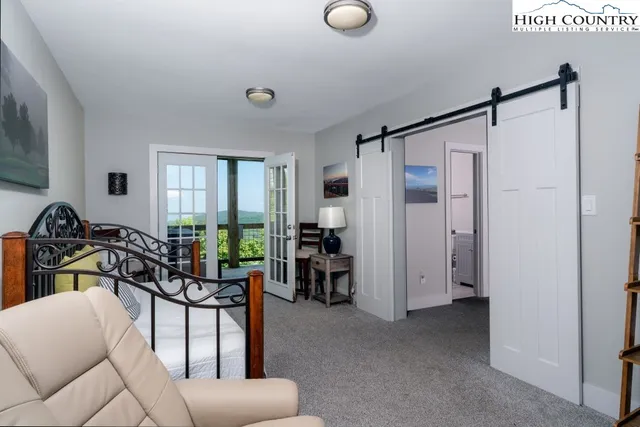 a view of a livingroom with furniture and windows