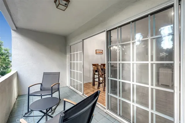 a view of a livingroom with furniture and a window