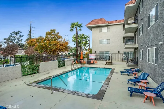 a view of a swimming pool with chairs
