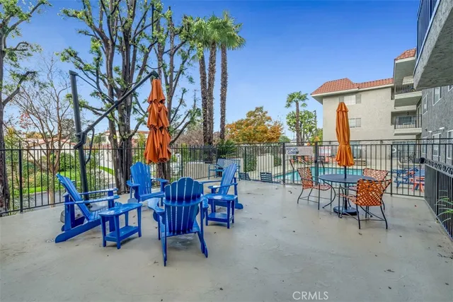 a view of a chairs and tables in the patio