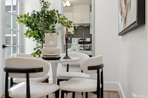 a bedroom with bed and wooden floor