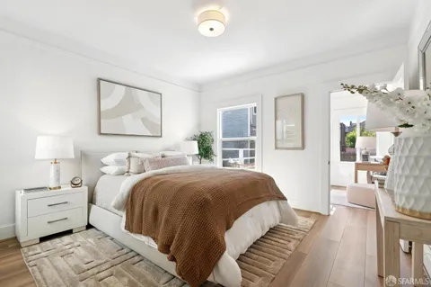 a view of living room with furniture and a potted plant
