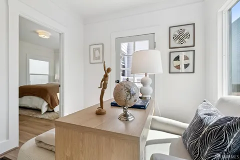 a bedroom with a bed and a lamp on table